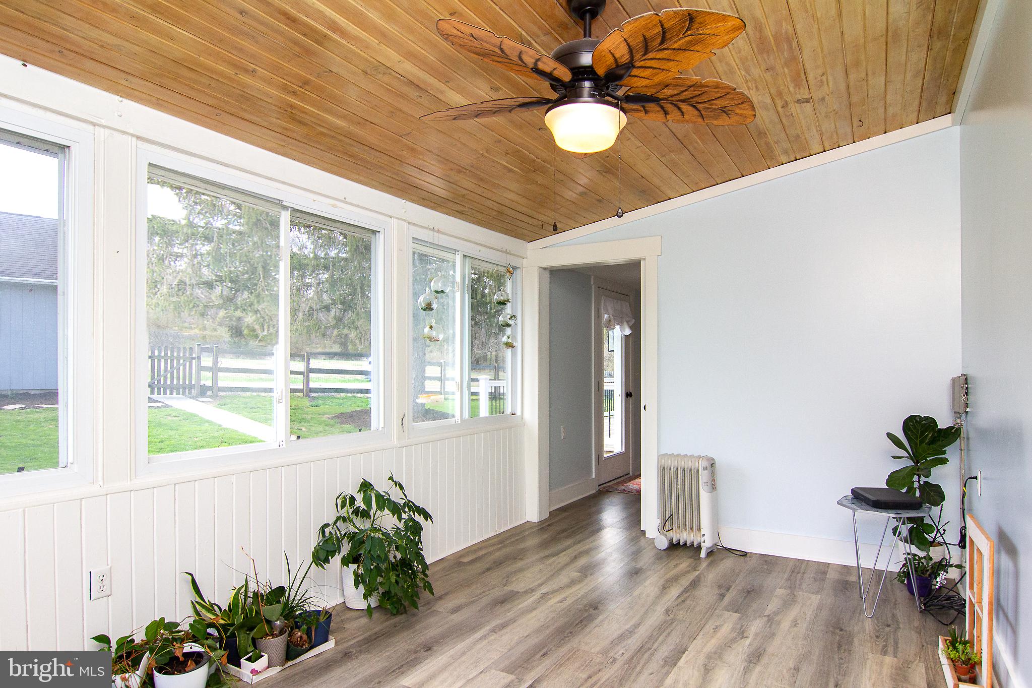3061 Emmitsburg Road Gettysburg, PA 17325 - Photo 13 of 47 a view of a hallway with wooden floor and a chandelier