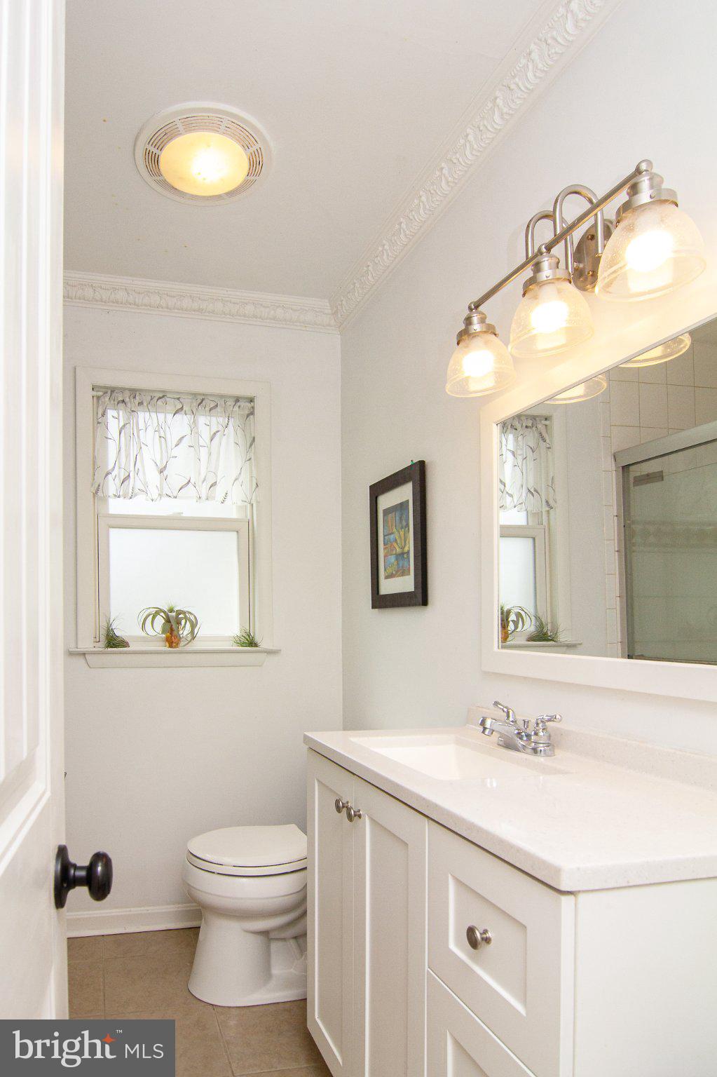 3061 Emmitsburg Road Gettysburg, PA 17325 - Photo 15 of 47 a bathroom with a sink a toilet and mirror