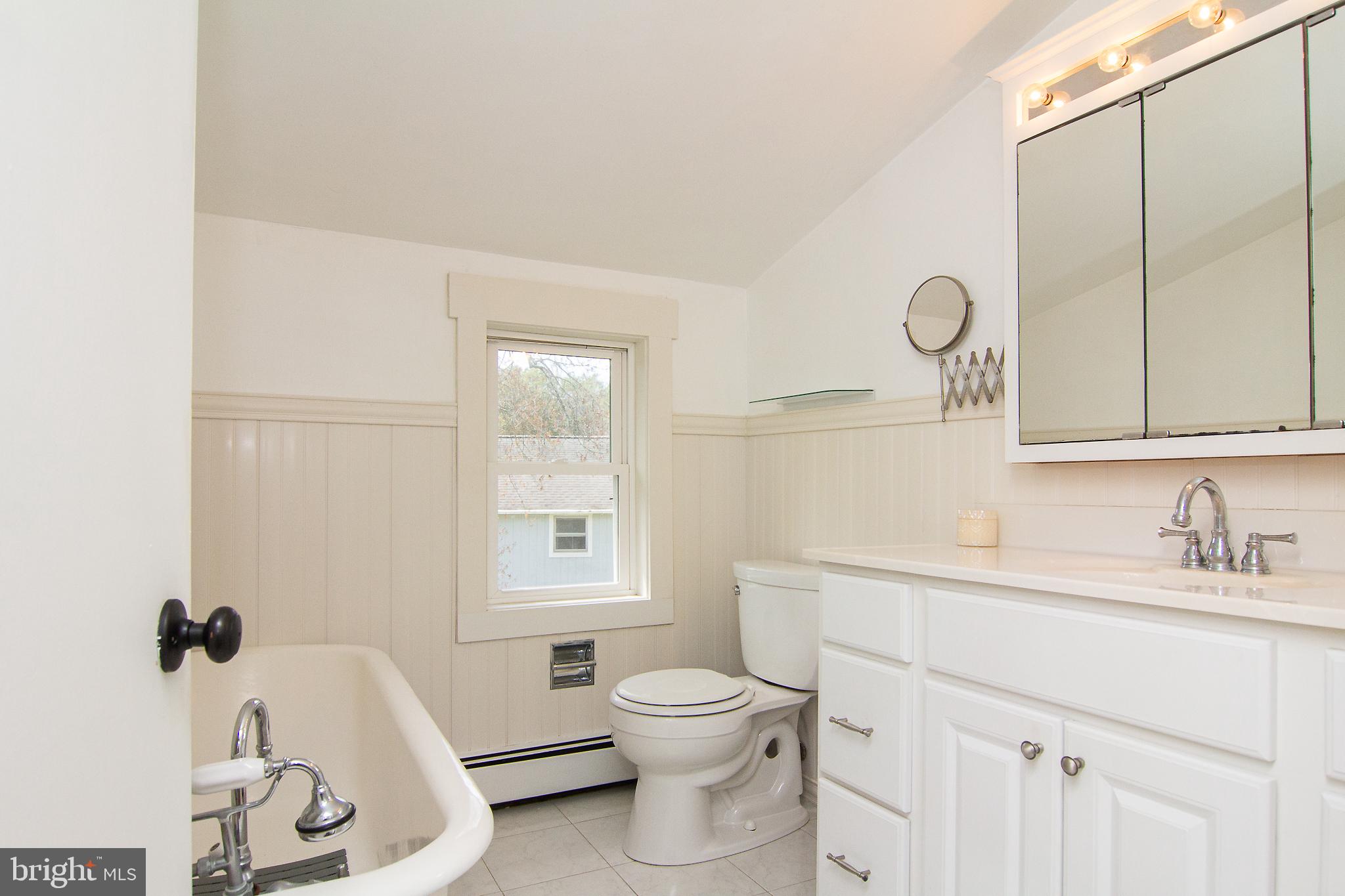 3061 Emmitsburg Road Gettysburg, PA 17325 - Photo 20 of 47 a bathroom with a toilet sink vanity tub and mirror