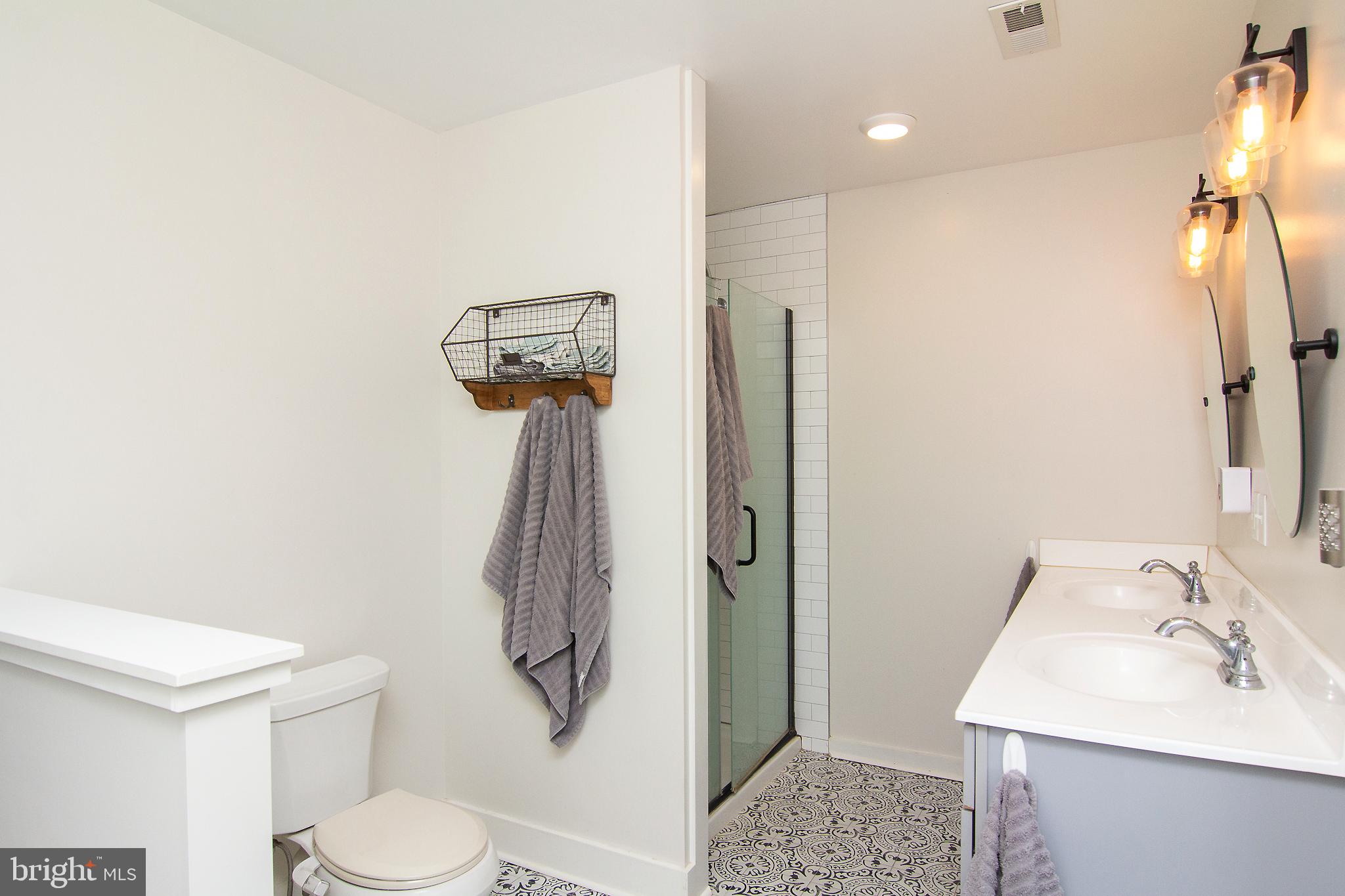 3061 Emmitsburg Road Gettysburg, PA 17325 - Photo 25 of 47 a bathroom with a sink toilet and shower