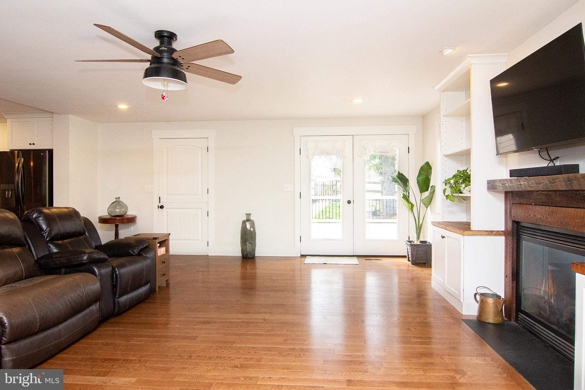 3061 Emmitsburg Road Gettysburg, PA 17325 - Photo 6 of 47 a living room with furniture and a flat screen tv