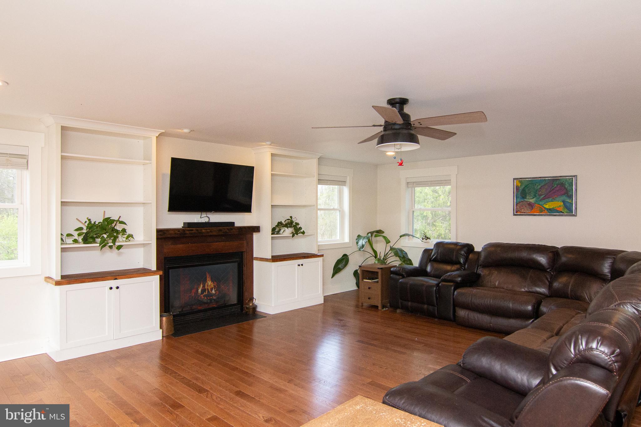 3061 Emmitsburg Road Gettysburg, PA 17325 - Photo 7 of 47 a living room with furniture a fireplace and a flat screen tv