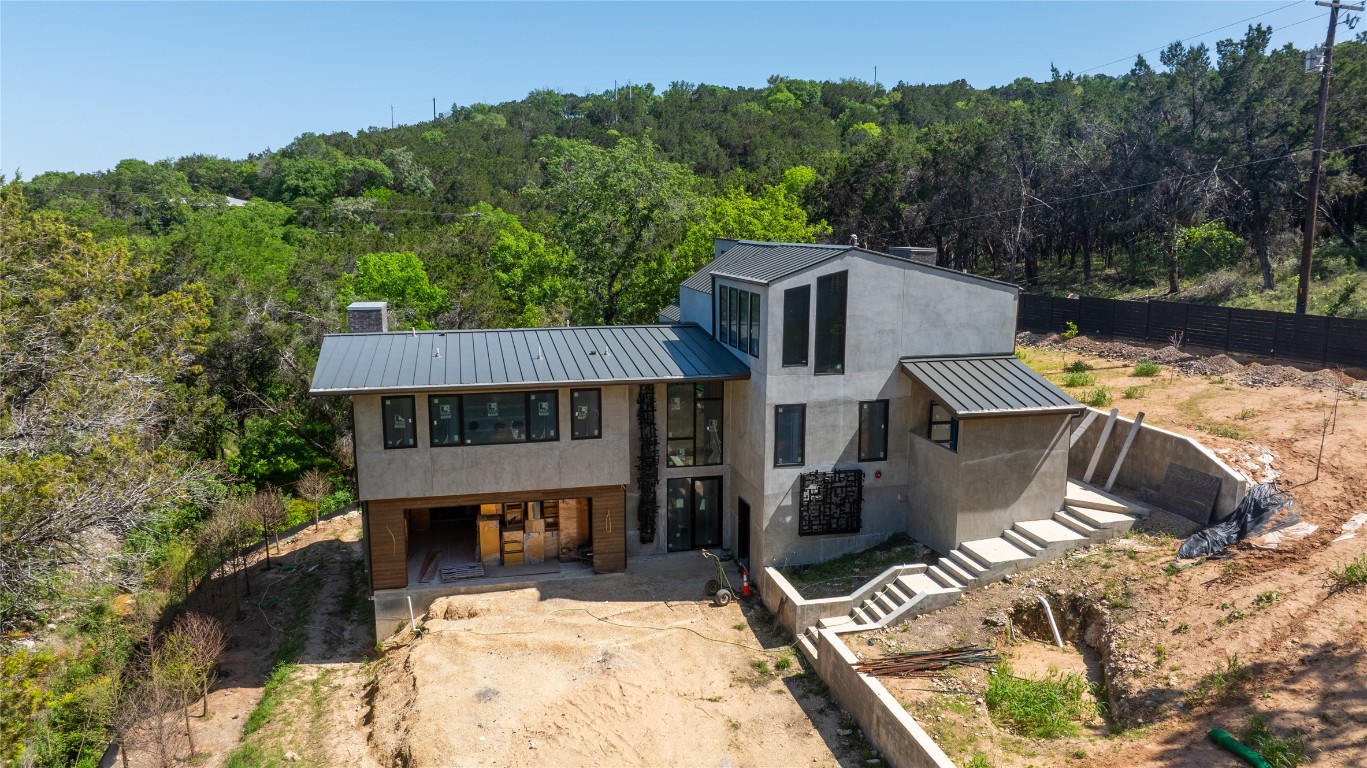 603 Spurlock Valley West Lake Hills, TX 78746 - Photo 1 of 13 an aerial view of a house with roof deck front of house