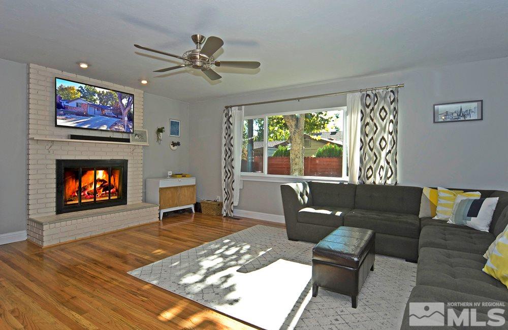 2390 Riviera Street Reno, NV 89509 - Photo 2 of 19 a living room with furniture and a fireplace