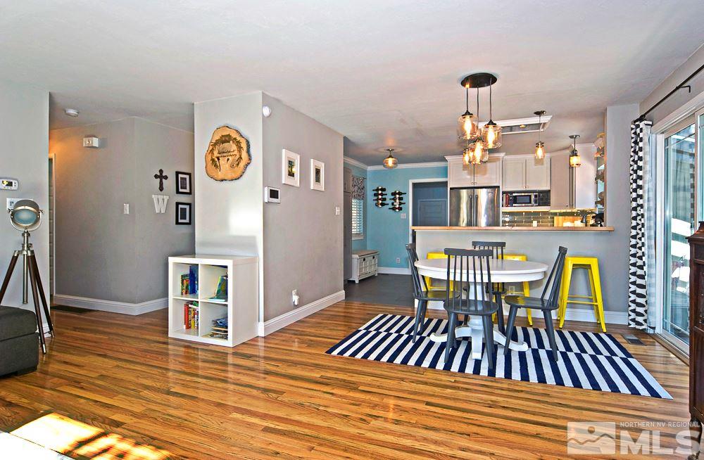 2390 Riviera Street Reno, NV 89509 - Photo 3 of 19 a view of a dining room with furniture and wooden floor