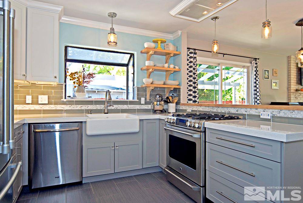 2390 Riviera Street Reno, NV 89509 - Photo 7 of 19 a kitchen with a stove a sink and a window