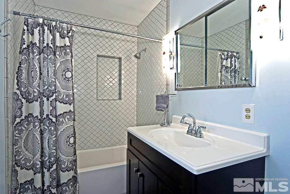 2390 Riviera Street Reno, NV 89509 - Photo 10 of 19 a bathroom with a sink and a mirror