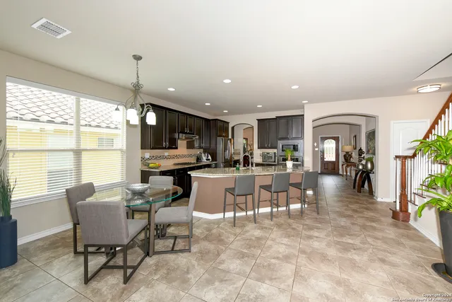 a view of a dining room with furniture window and outside view