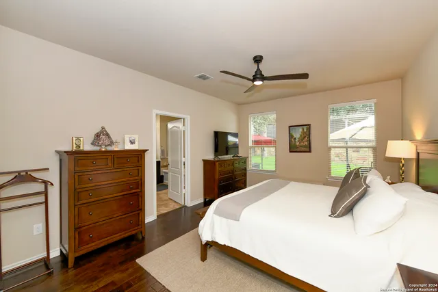 a bed room with a bed and a television