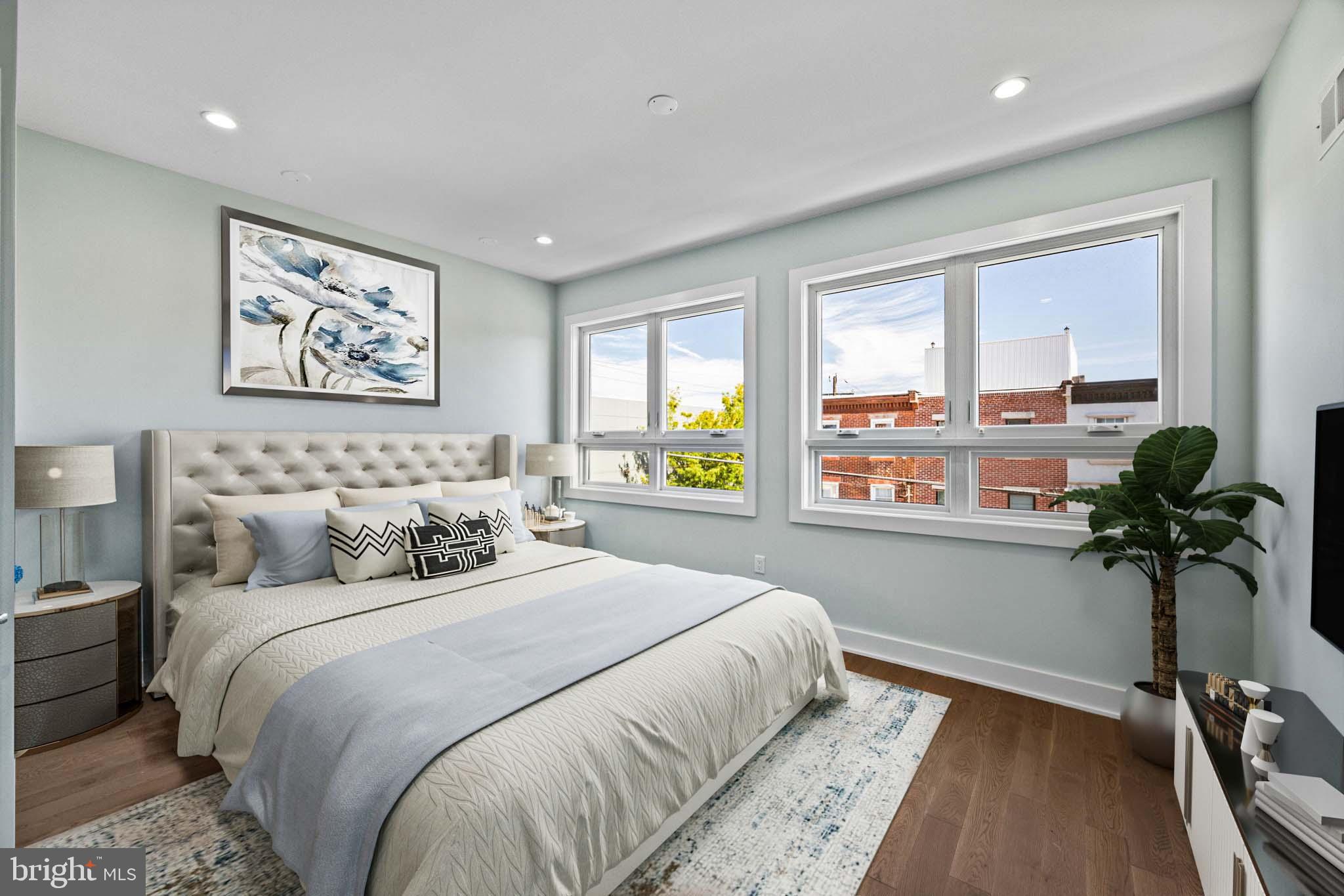 2202 East Huntingdon Street Philadelphia, PA 19125 - Photo 21 of 42 a bedroom with bed and a large window