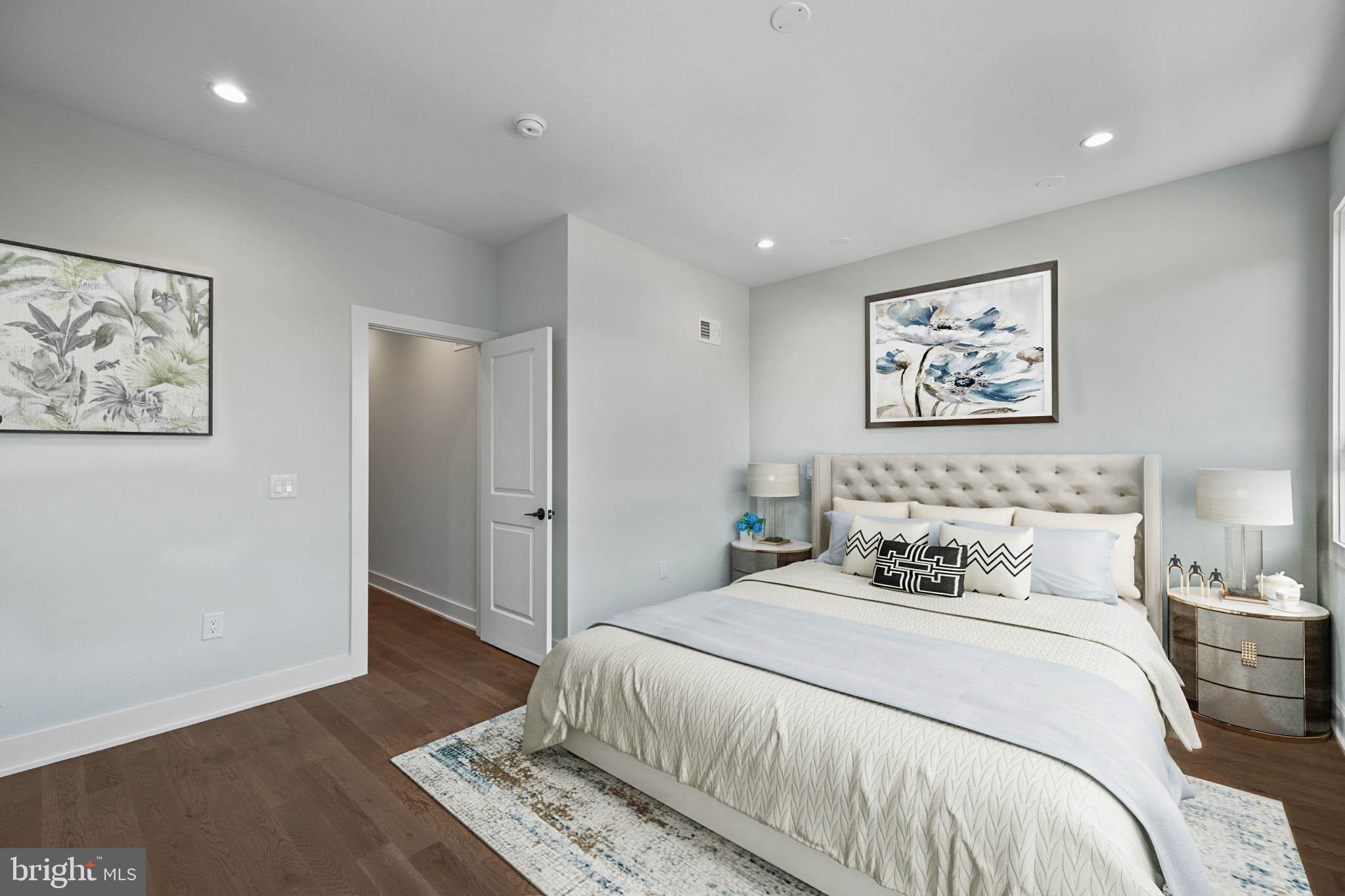 2202 East Huntingdon Street Philadelphia, PA 19125 - Photo 22 of 42 a bedroom with a bed and wooden floor