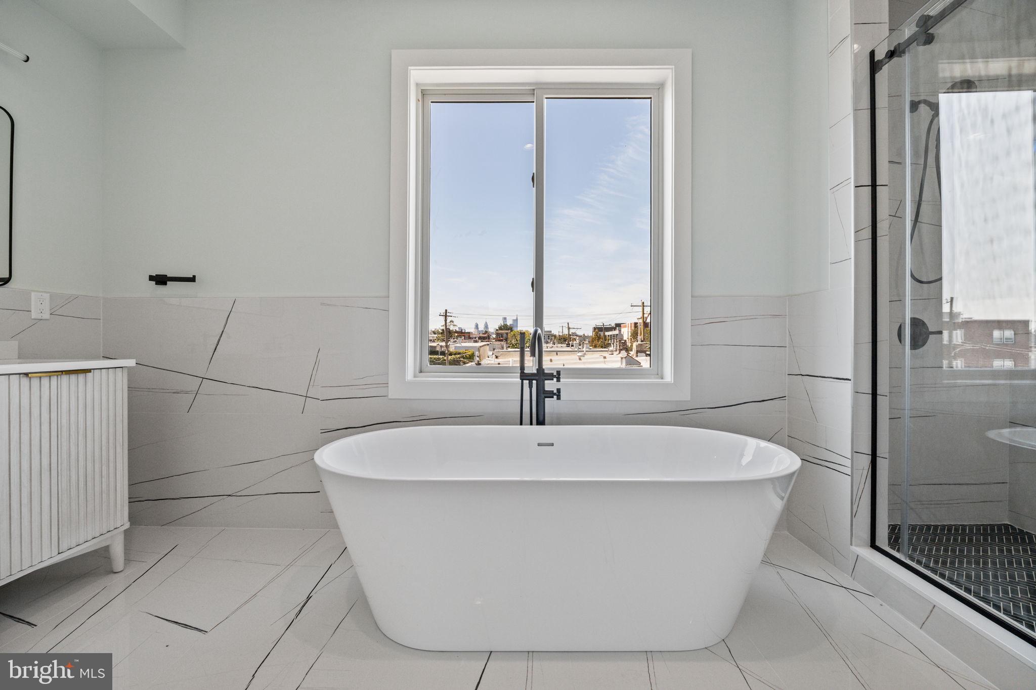2202 East Huntingdon Street Philadelphia, PA 19125 - Photo 28 of 42 a white bath tub sitting in a bathroom