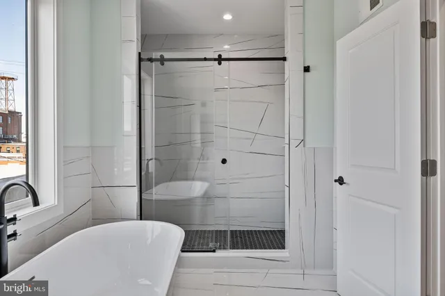 a bathroom with a shower and a sink