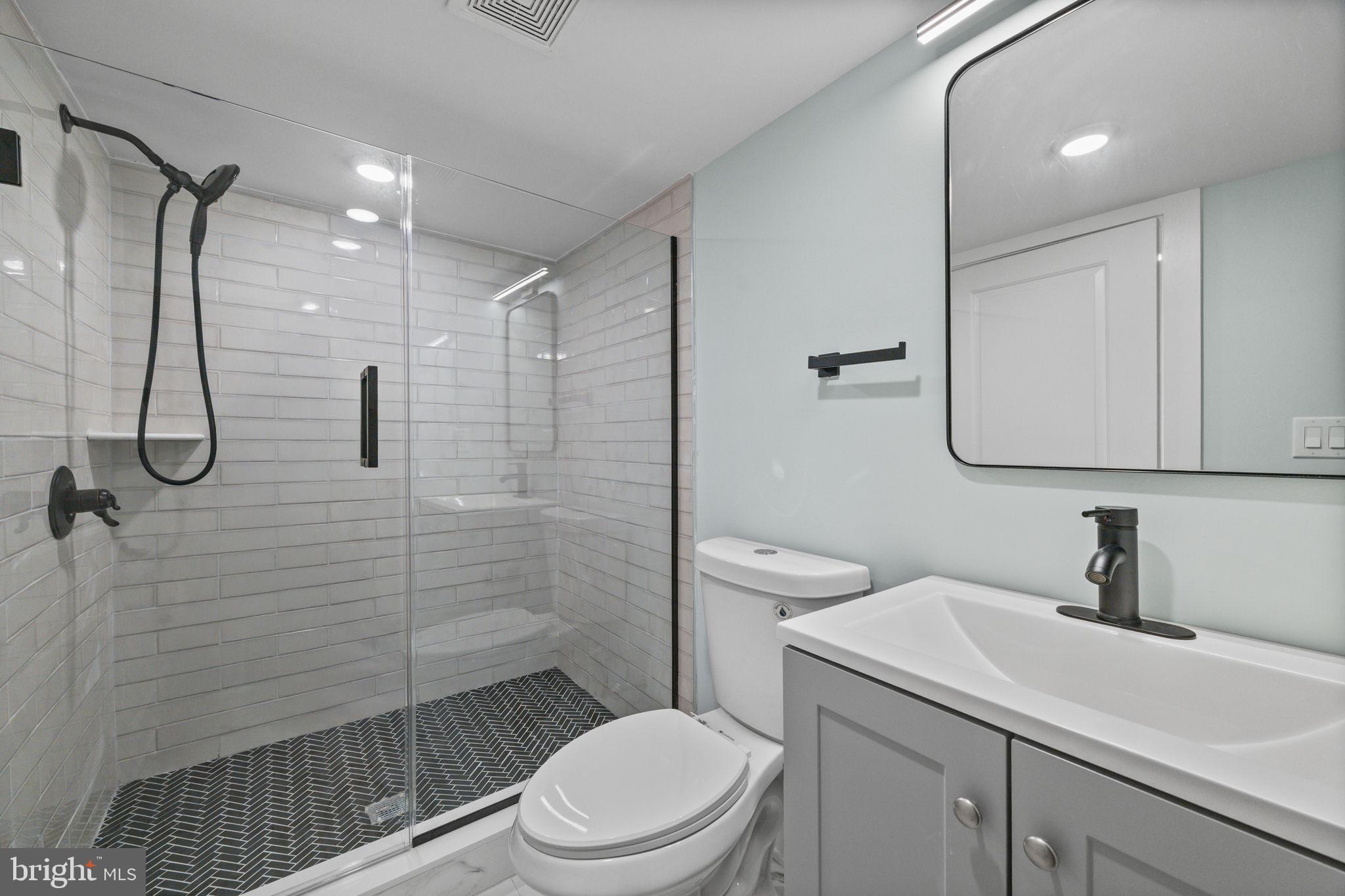 2202 East Huntingdon Street Philadelphia, PA 19125 - Photo 37 of 42 a bathroom with a sink toilet and shower