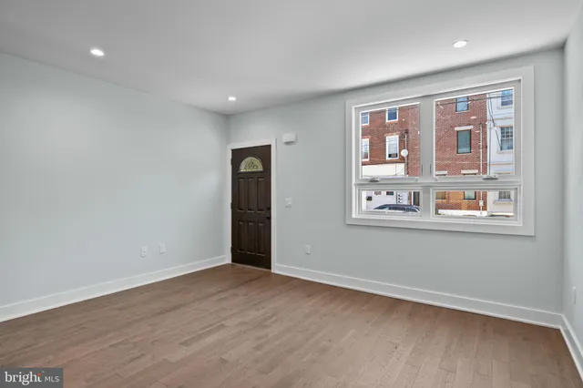 a view of an empty room with a window