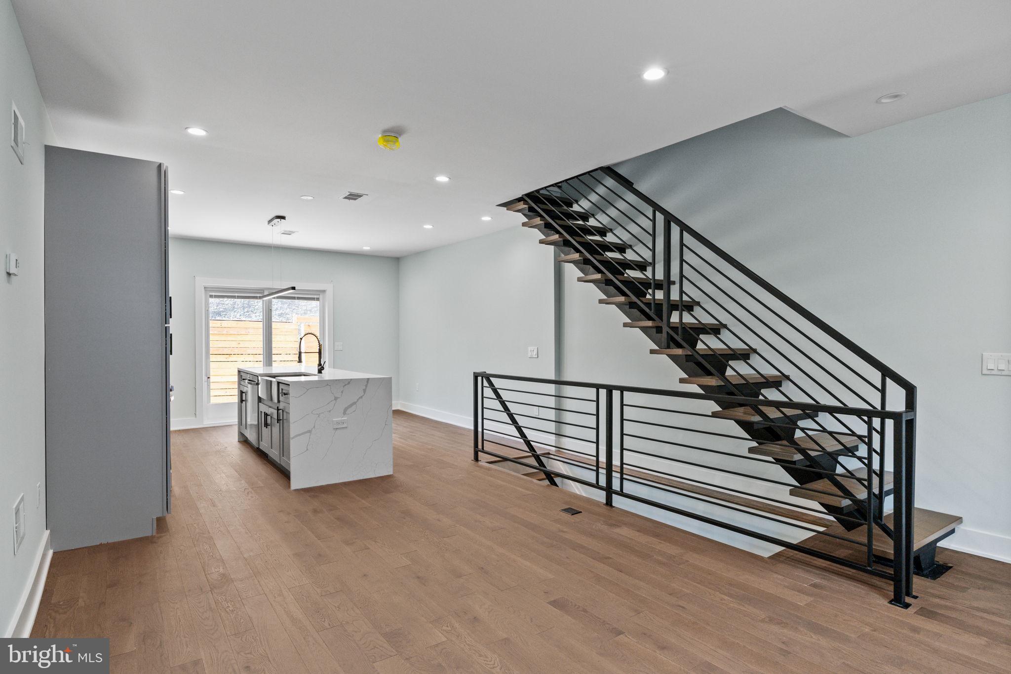 2202 East Huntingdon Street Philadelphia, PA 19125 - Photo 7 of 42 a view of entryway and hall with wooden floor
