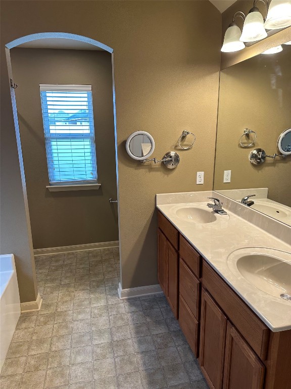7518 Amber Meadow Loop Temple, TX 76502 - Photo 17 of 35 a bathroom with a sink a vanity and a mirror