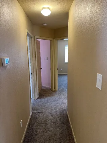 a view of a hallway with closet