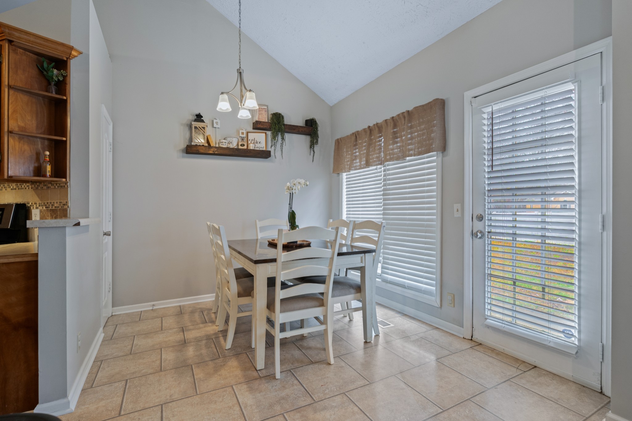 79 Hunt Creek Road Manchester, TN 37355 - Photo 11 of 28 a view of a dining room with furniture and a chandelier