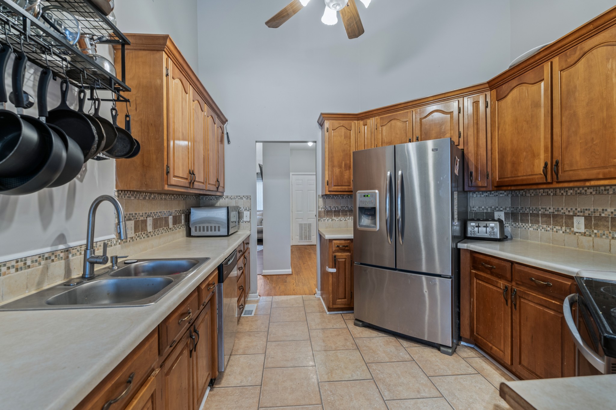 79 Hunt Creek Road Manchester, TN 37355 - Photo 13 of 28 a kitchen with stainless steel appliances granite countertop a sink stove and refrigerator
