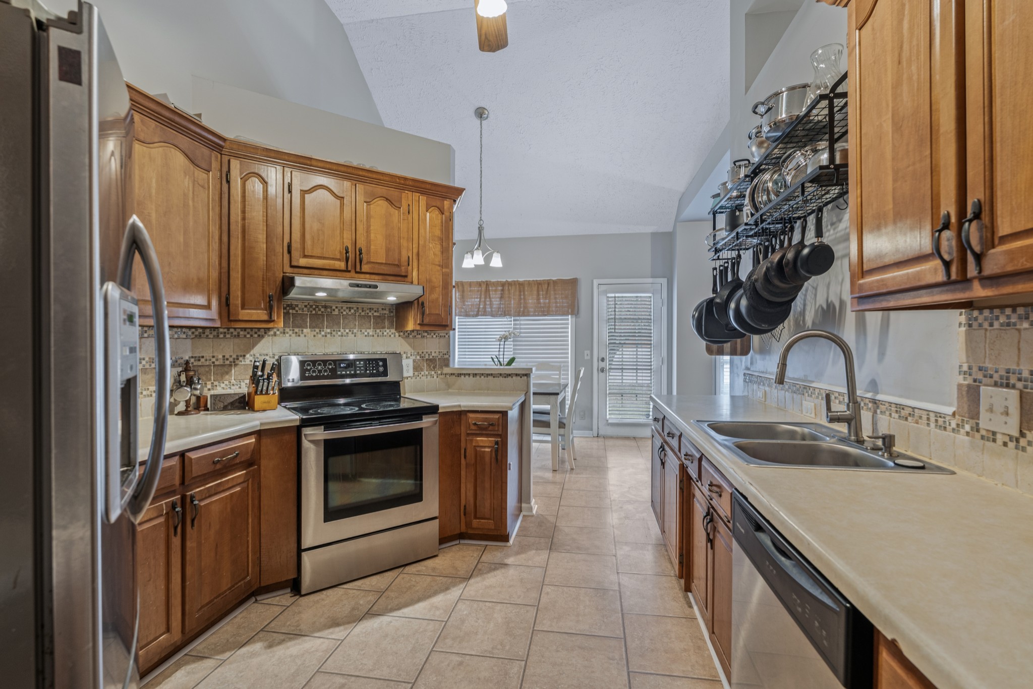 79 Hunt Creek Road Manchester, TN 37355 - Photo 14 of 28 a kitchen with stainless steel appliances granite countertop a sink stove and refrigerator