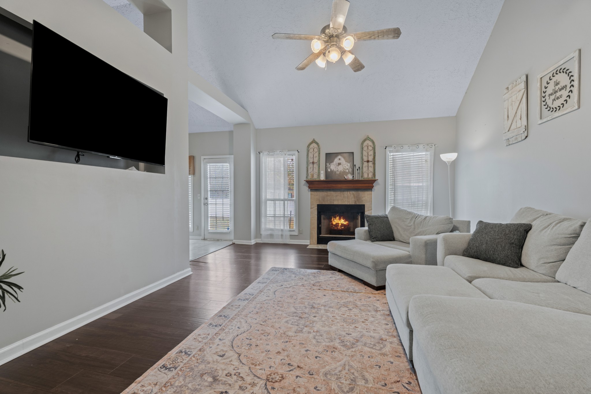 79 Hunt Creek Road Manchester, TN 37355 - Photo 7 of 28 a living room with furniture a fireplace and a flat screen tv