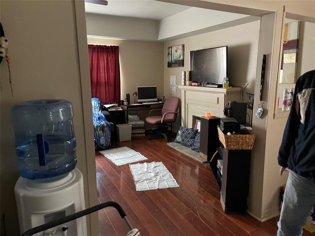 2130 South 2nd Street, Unit B Abilene, TX 79605 - Photo 4 of 12 a living room with furniture and a flat screen tv