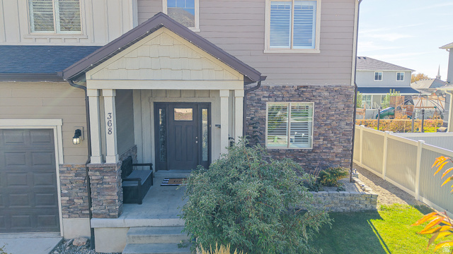 368 East 700 North Springville, UT 84663 - Photo 51 of 55 Property entrance with stone siding and board and batten siding