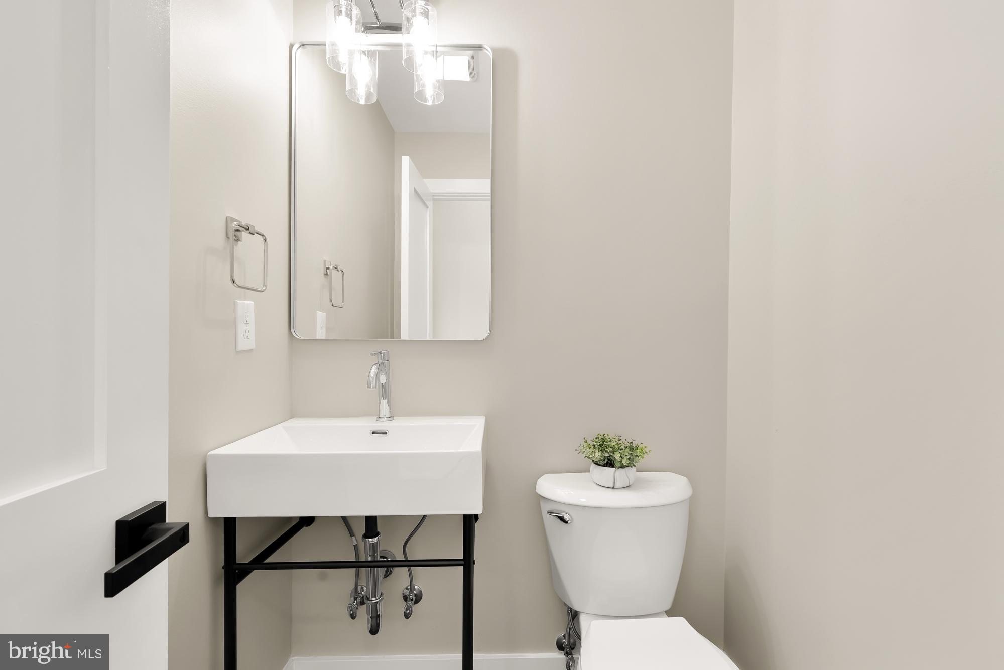 4024 Simms Drive Kensington, MD 20895 - Photo 19 of 42 New Powder room family room and side backyard door