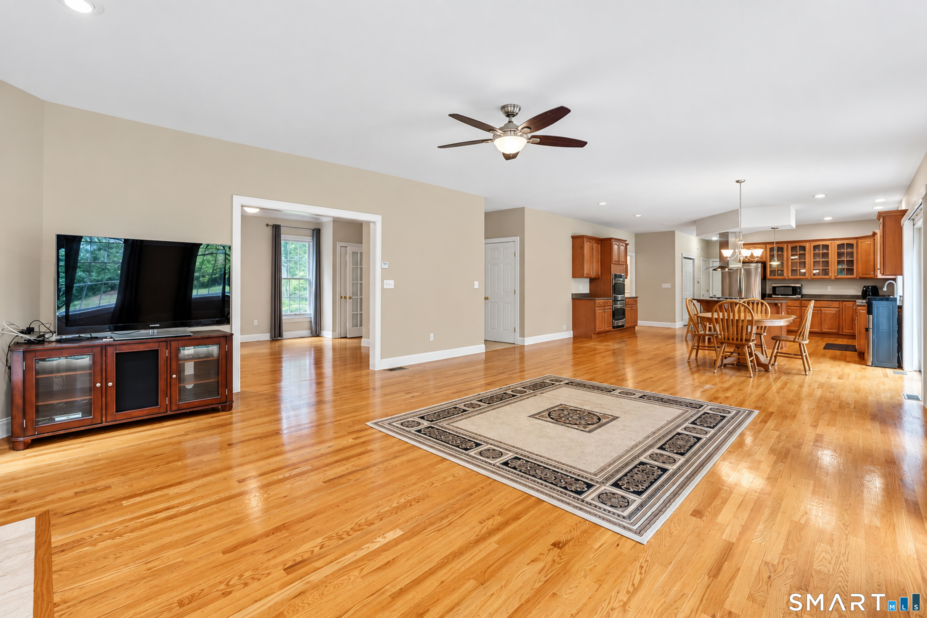 24 Judd Hill Road Bethany, CT 06524 - Photo 9 of 23 Did we say this space was large? The formal living room opens off to the left, along the front of the house.