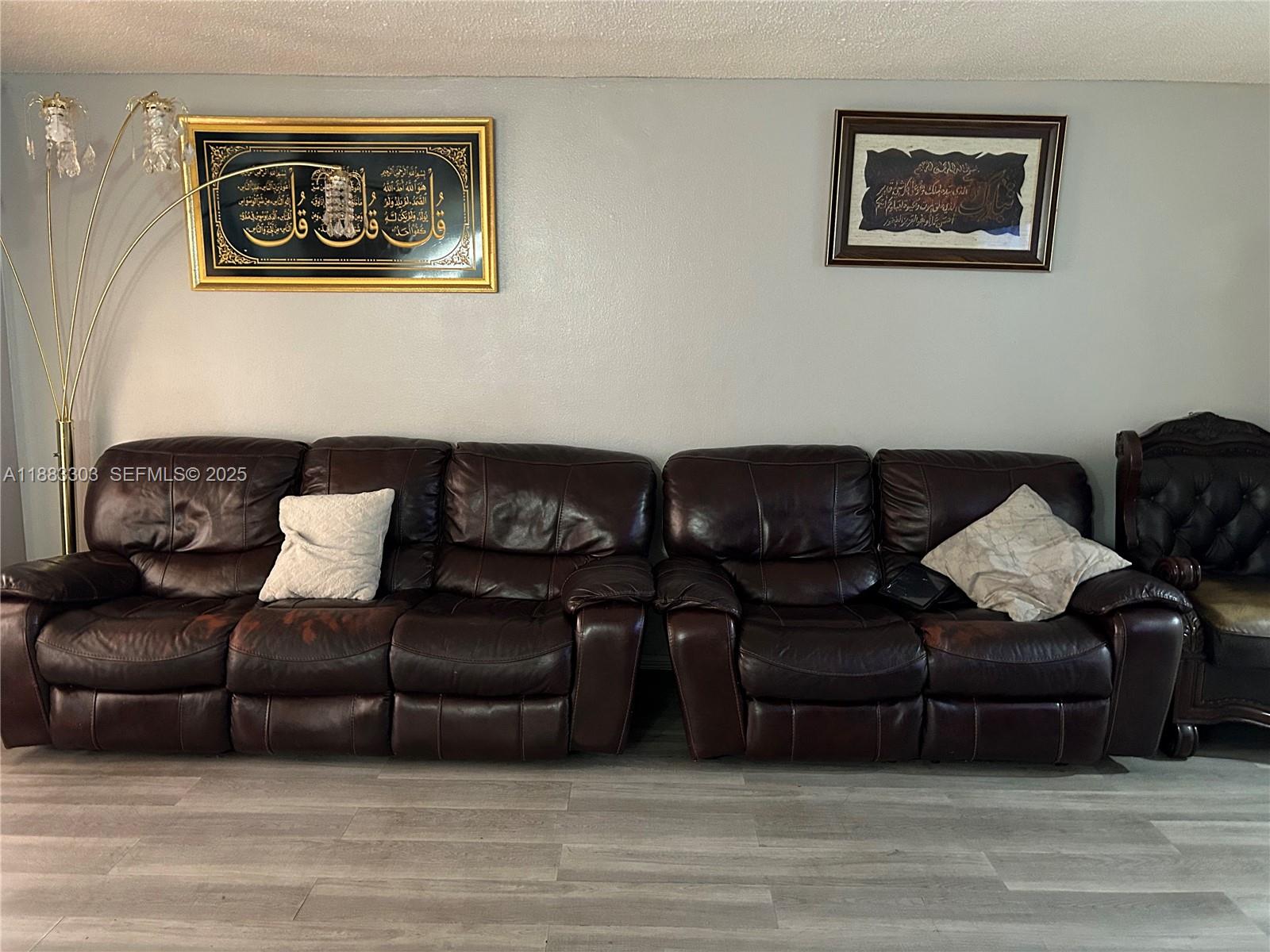 18111 Northwest 68th Avenue, Unit G206 Hialeah, FL 33015 - Photo 5 of 30 a living room with furniture