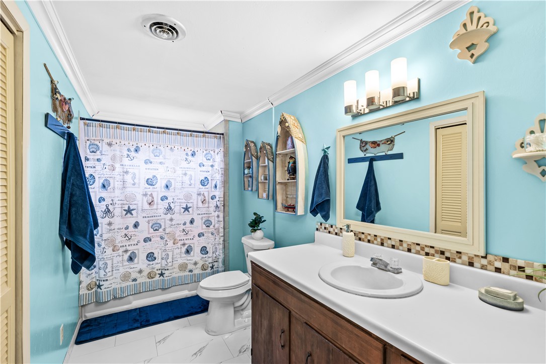 9505 County Road 505 Mathis, TX 78368 - Photo 15 of 19 a bathroom with a sink toilet and shower