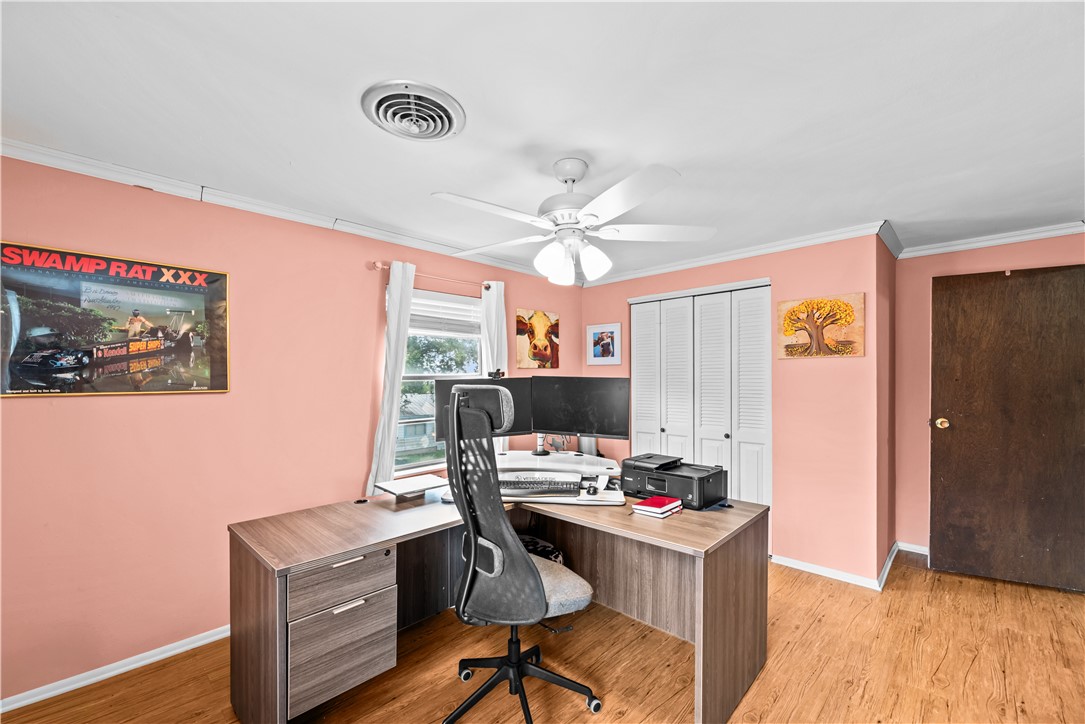 9505 County Road 505 Mathis, TX 78368 - Photo 17 of 19 a view of a workspace with furniture and a flat screen tv