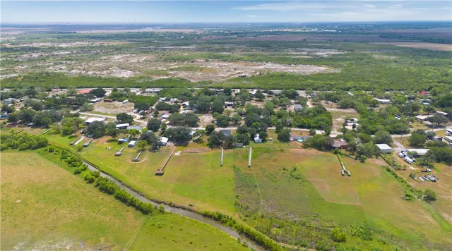 a view of an ocean with a building in the background