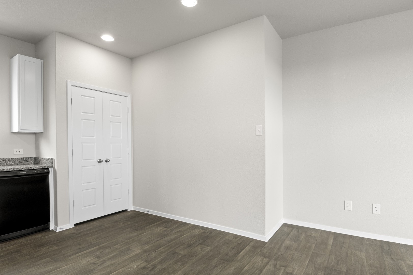 2963 Winding Creek Road Kyle, TX 78640 - Photo 12 of 28 a view of an empty room with wooden floor and a window