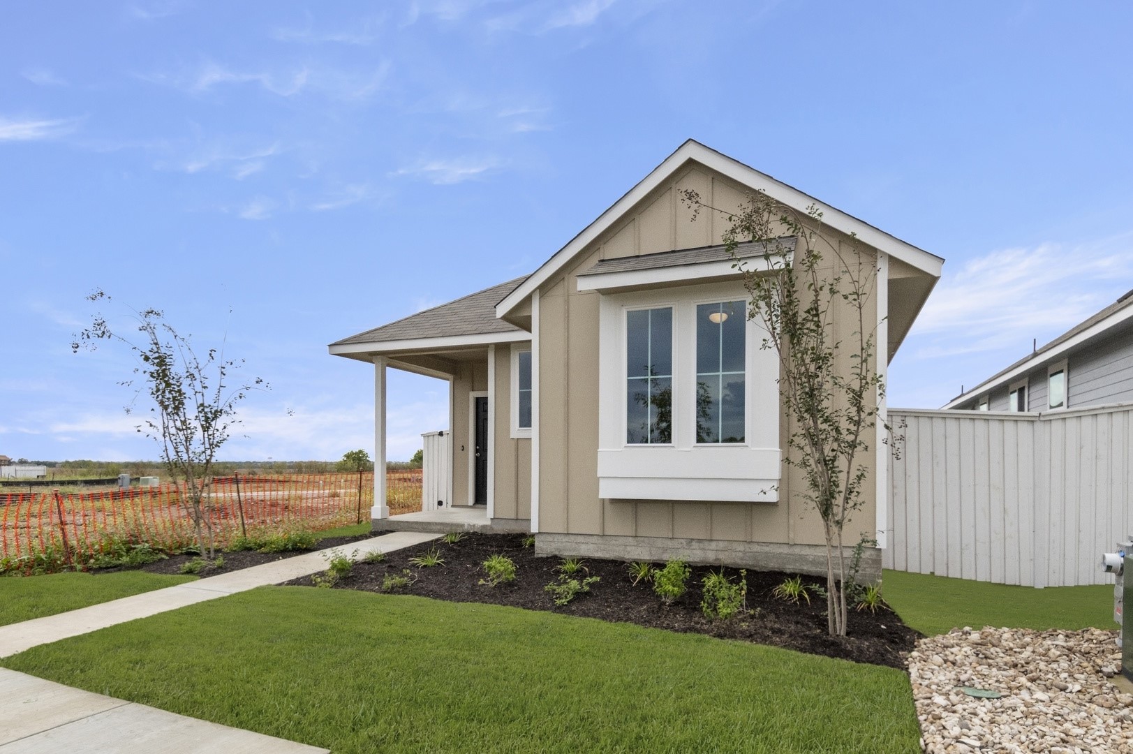 2963 Winding Creek Road Kyle, TX 78640 - Photo 2 of 28 a front view of a house with a yard