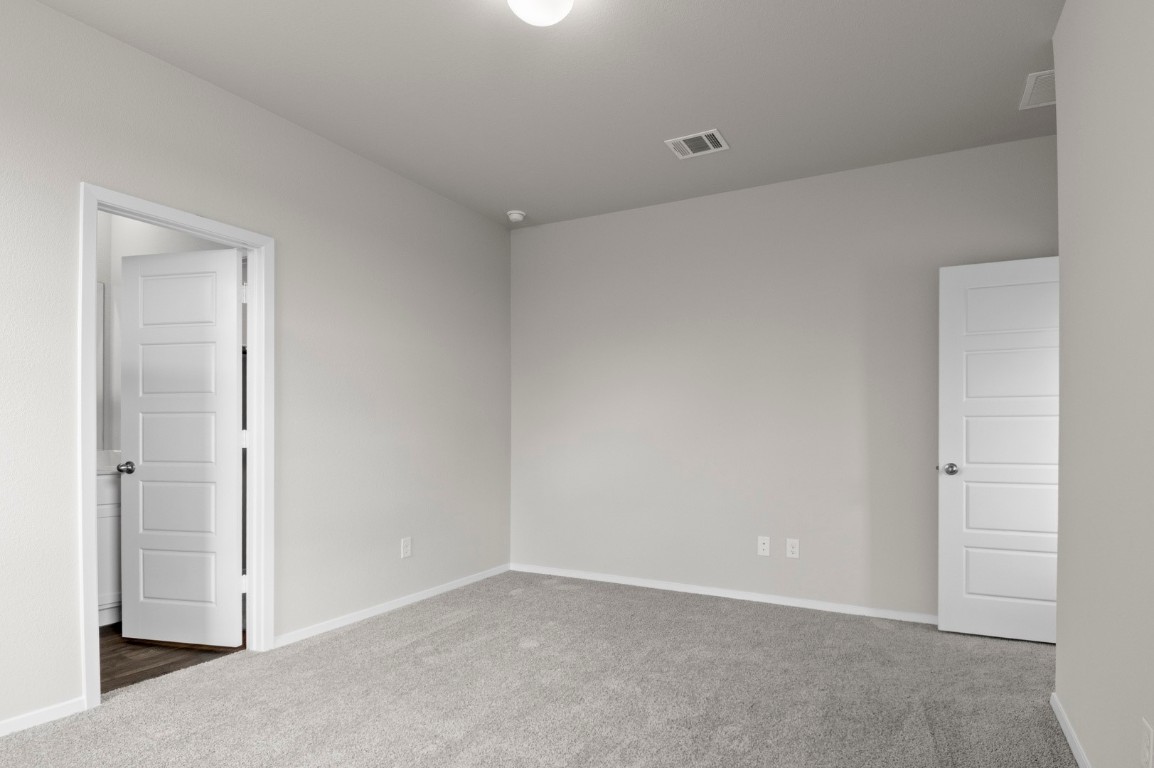 2963 Winding Creek Road Kyle, TX 78640 - Photo 21 of 28 a view of an empty room