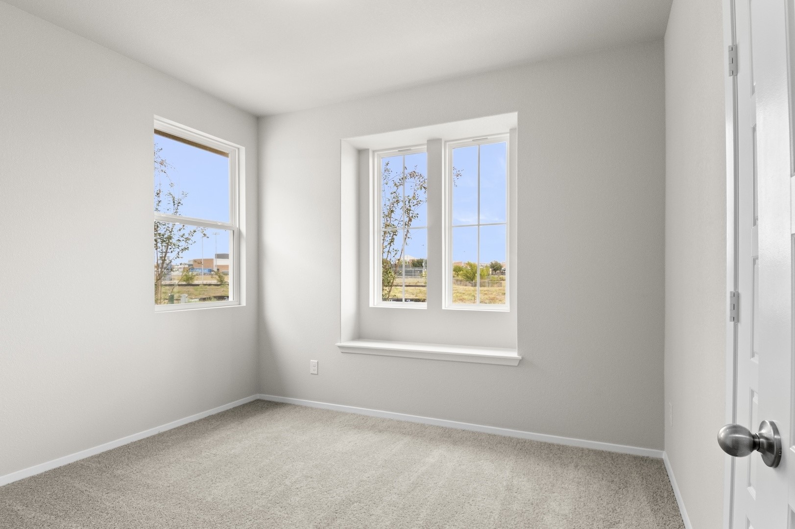 2963 Winding Creek Road Kyle, TX 78640 - Photo 25 of 28 an empty room with windows
