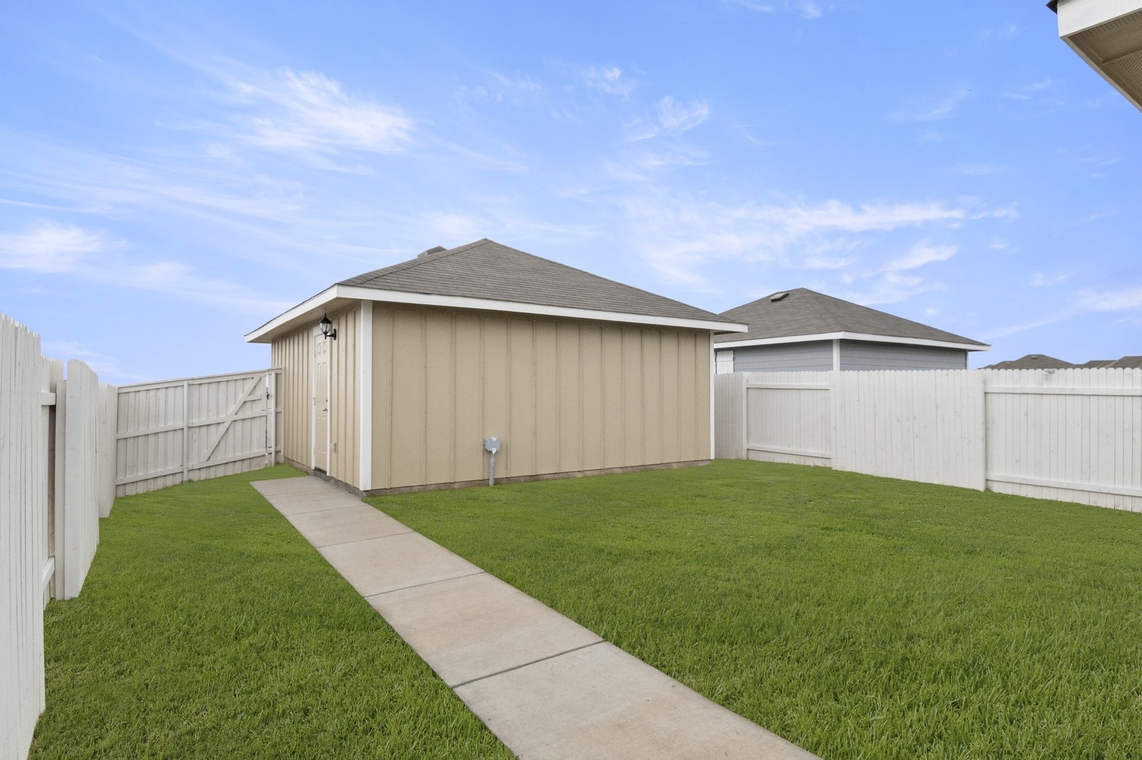 2963 Winding Creek Road Kyle, TX 78640 - Photo 27 of 28 a view of an house with backyard space and garden