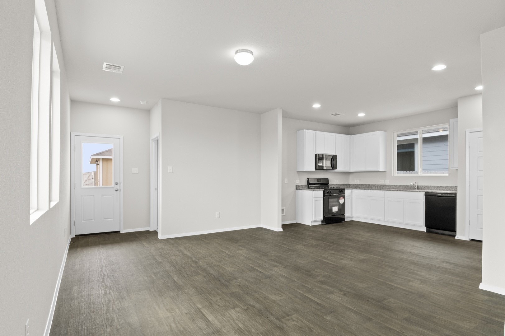 2963 Winding Creek Road Kyle, TX 78640 - Photo 5 of 28 a view of a kitchen with refrigerator and window