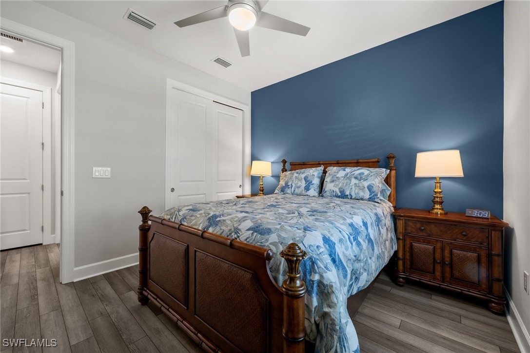 42243 Edgewater Drive Punta Gorda, FL 33982 - Photo 19 of 46 a bedroom with a bed and a dresser