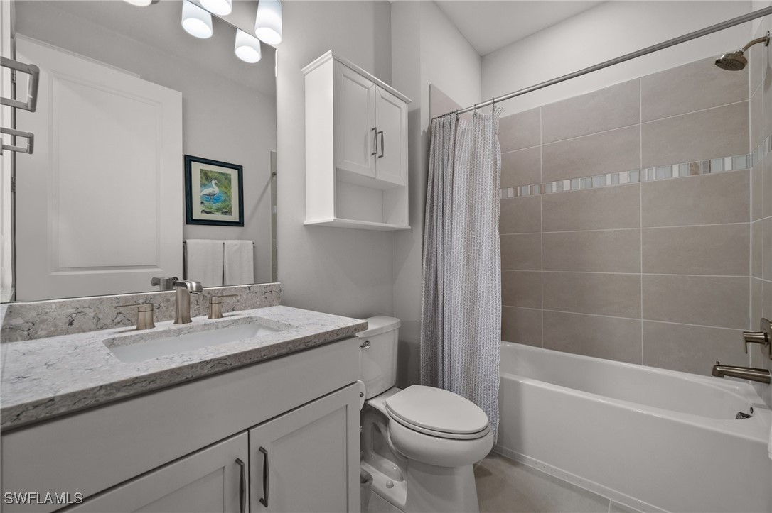 42243 Edgewater Drive Punta Gorda, FL 33982 - Photo 20 of 46 a bathroom with a sink a toilet and shower