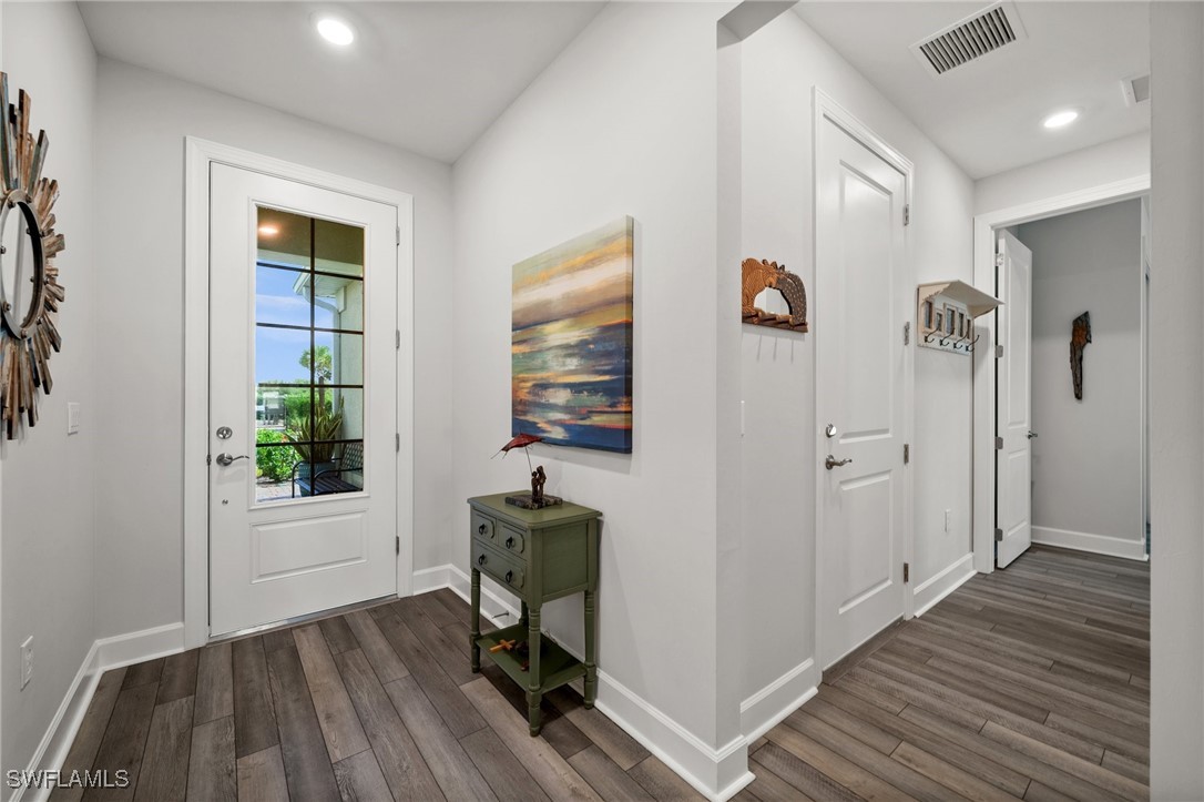 42243 Edgewater Drive Punta Gorda, FL 33982 - Photo 25 of 46 a view of a workspace with wooden floor and windows