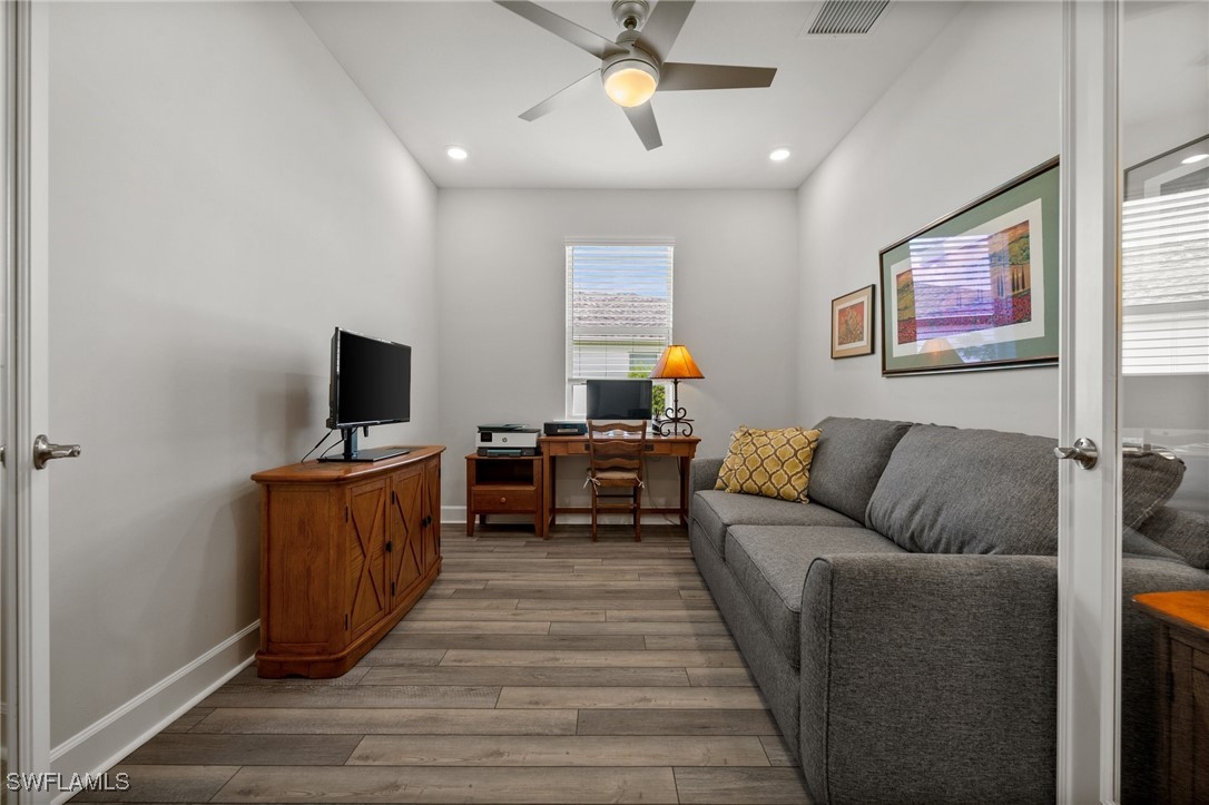 42243 Edgewater Drive Punta Gorda, FL 33982 - Photo 27 of 46 a living room with furniture and a flat screen tv