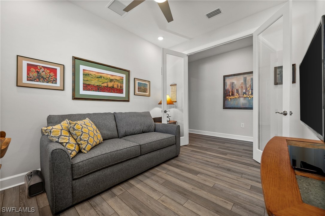 42243 Edgewater Drive Punta Gorda, FL 33982 - Photo 28 of 46 a living room with furniture and a flat screen tv