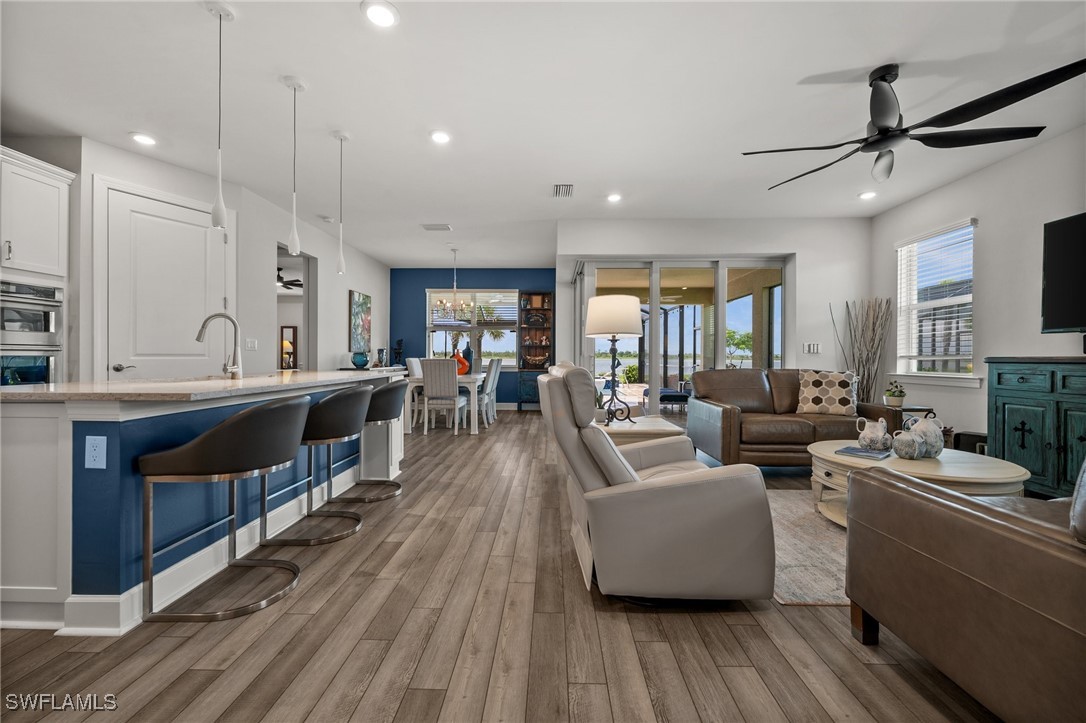 42243 Edgewater Drive Punta Gorda, FL 33982 - Photo 29 of 46 a living room with furniture and a wooden floor