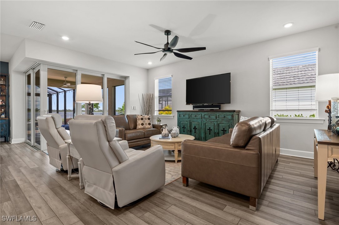 42243 Edgewater Drive Punta Gorda, FL 33982 - Photo 30 of 46 a living room with fireplace furniture and a flat screen tv