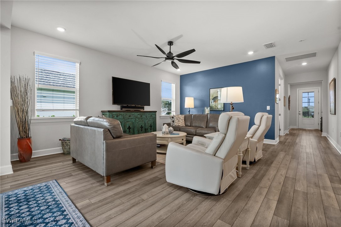 42243 Edgewater Drive Punta Gorda, FL 33982 - Photo 32 of 46 a living room with furniture and a flat screen tv