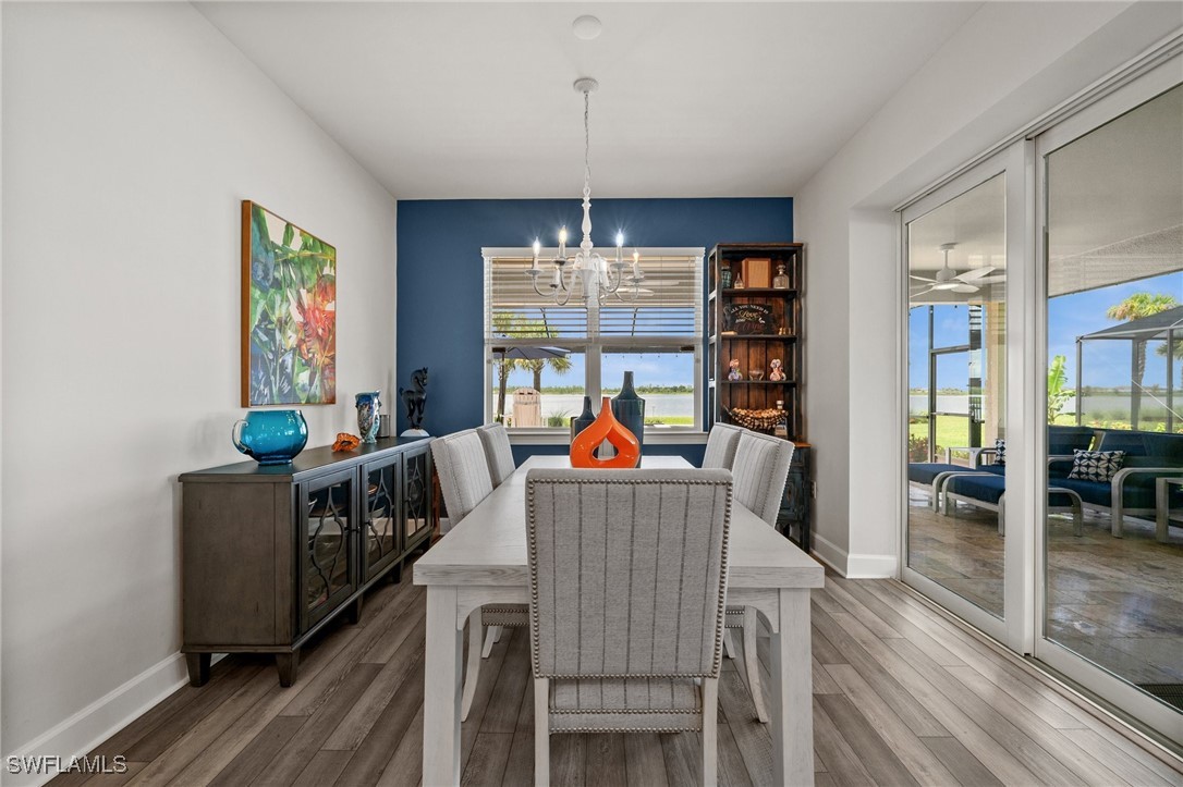 42243 Edgewater Drive Punta Gorda, FL 33982 - Photo 34 of 46 a view of a dining room with furniture window and wooden floor