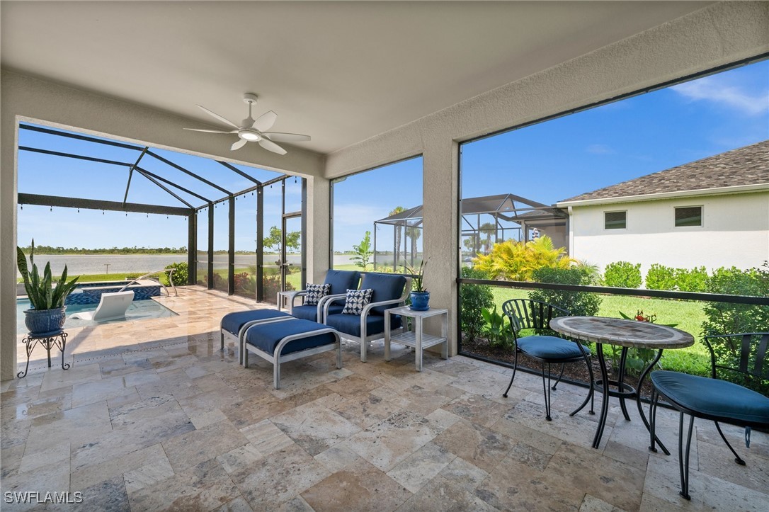 42243 Edgewater Drive Punta Gorda, FL 33982 - Photo 40 of 46 a living room with patio furniture and a large window